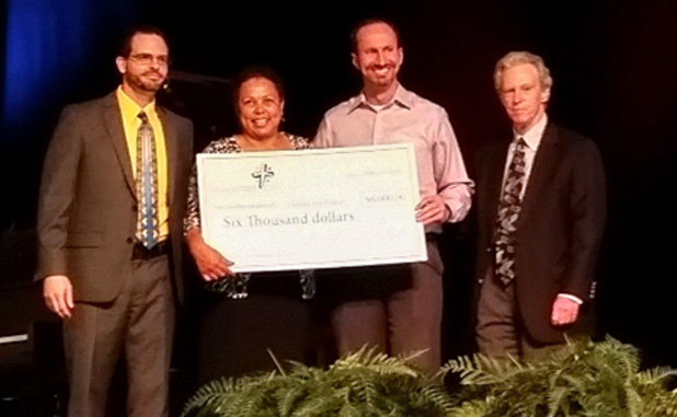 PTC Seventh-day Adventist church presents checks...