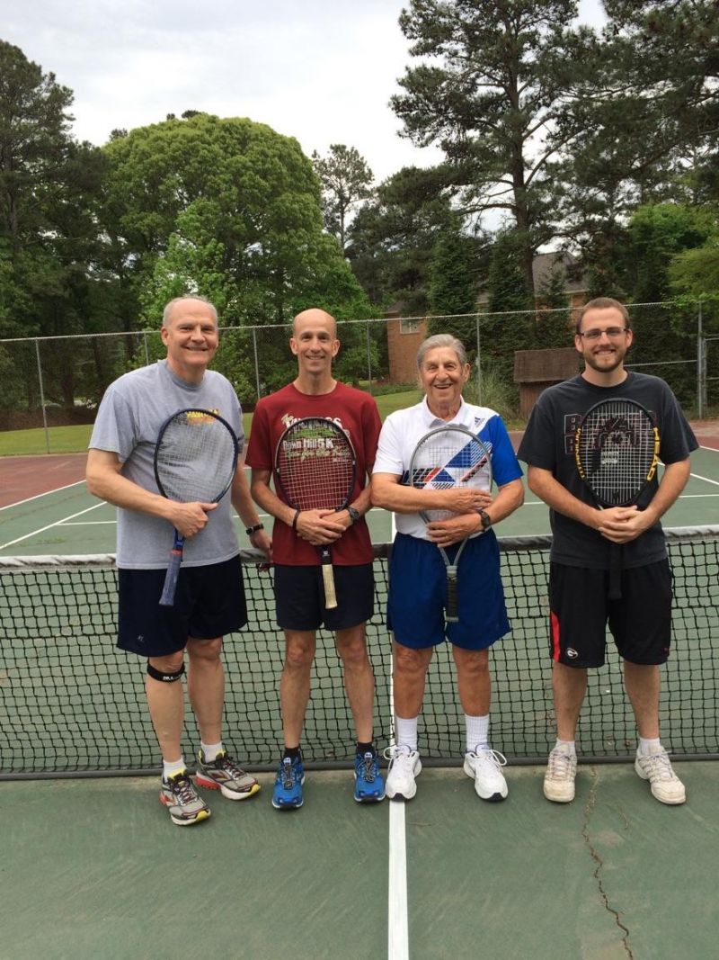 Three generations play tennis to stay fit