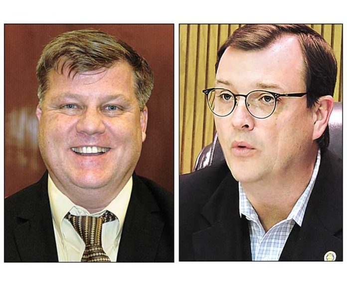 Fayette County Administrator Steve Rapson (L) and Commissioner Steve Brown. File photos.