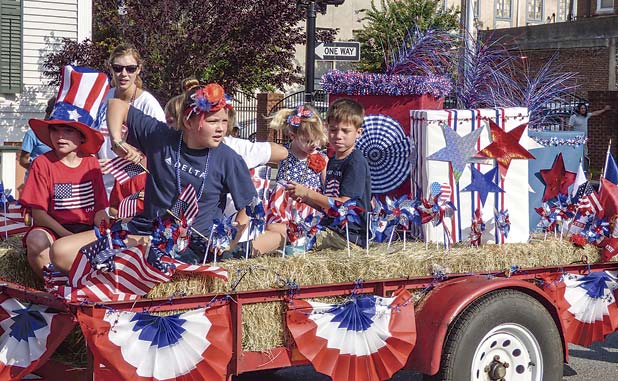 Flag-waving crowds line streets in Newnan July 4...