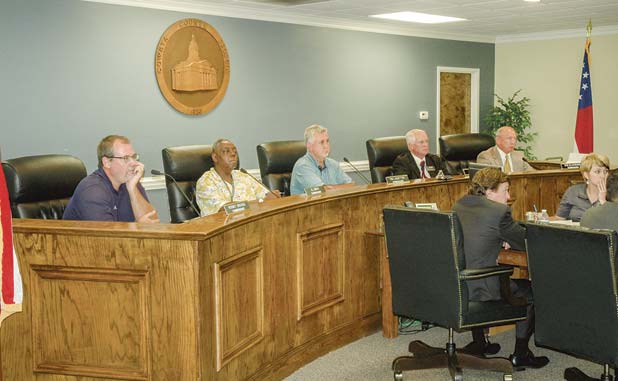 Coweta bows to pressure and rolls back rate