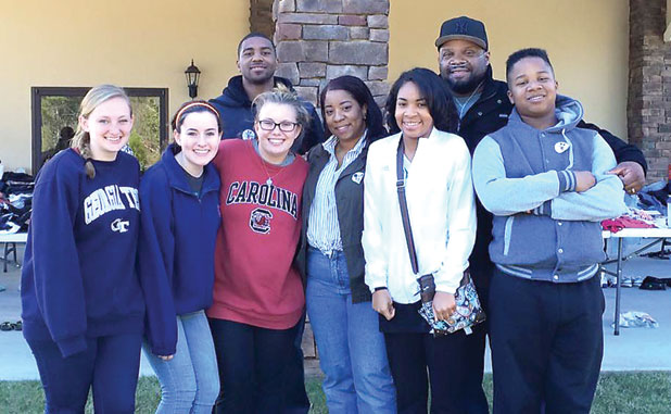 Teens help family rebuild